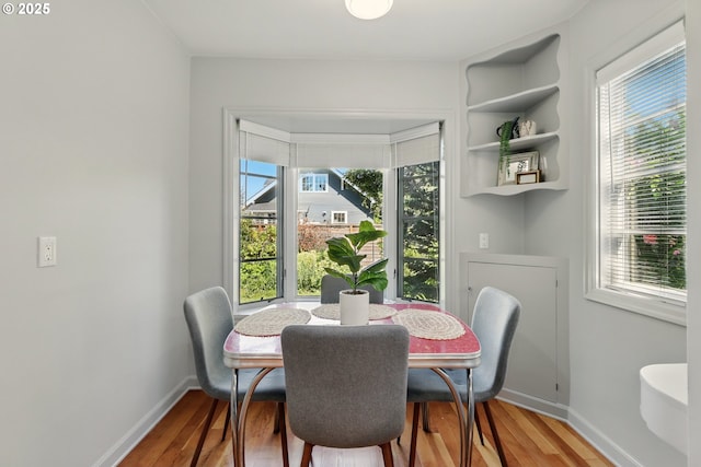 2804 NE 46th Ave, Portland, OR 97213 - dining room with healthy amount of natural light, baseboards, and light wood-style flooring