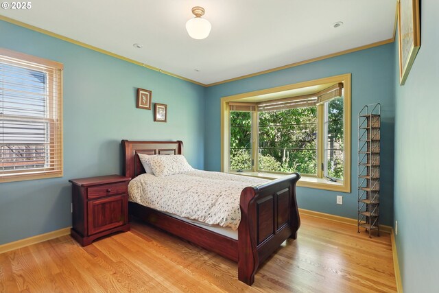 2804 NE 46th Ave, Portland, OR 97213 - bedroom with light wood finished floors, baseboards, and ornamental molding