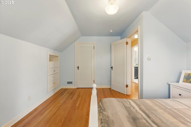 2804 NE 46th Ave, Portland, OR 97213 - bedroom featuring vaulted ceiling, light wood-type flooring, and baseboards
