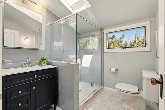 2804 NE 46th Ave, Portland, OR 97213 - full bath with a skylight, healthy amount of natural light, toilet, and vanity