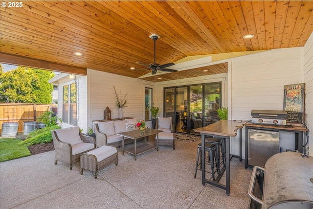 view of patio featuring a ceiling fan, fence, and an outdoor hangout area