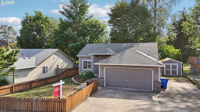 1041 40th St, Washougal, WA 98671 - view of front of house featuring driveway, a shed, an attached garage, a shingled roof, and brick siding