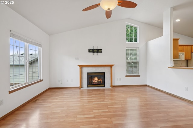 1041 40th St, Washougal, WA 98671 - unfurnished living room with lofted ceiling, light wood finished floors, a ceiling fan, a tile fireplace, and recessed lighting
