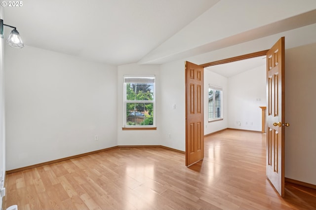 1041 40th St, Washougal, WA 98671 - spare room with lofted ceiling and light wood-style flooring