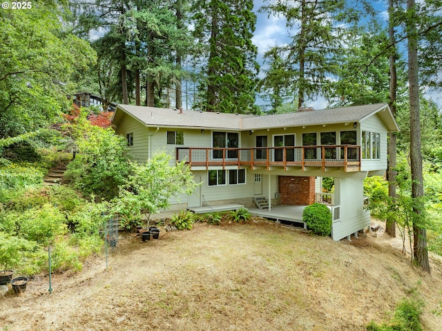 2830 Capital Dr, Eugene, OR 97403 - back of property featuring a wooden deck and roof with shingles