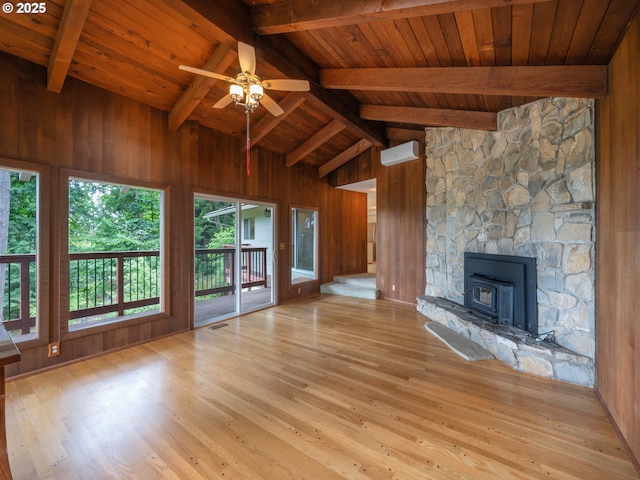 2830 Capital Dr, Eugene, OR 97403 - unfurnished living room featuring wood walls, a wood ceiling with exposed beams, wood finished floors, a ceiling fan, and a wood stove