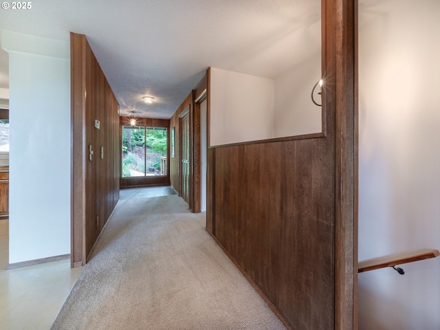 2830 Capital Dr, Eugene, OR 97403 - hall with wood walls and light carpet