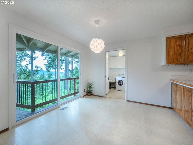 2830 Capital Dr, Eugene, OR 97403 - unfurnished dining area with washer / dryer and light flooring