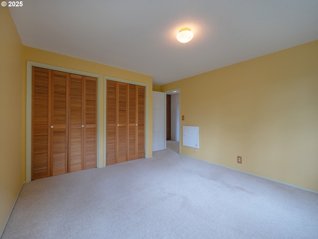 2830 Capital Dr, Eugene, OR 97403 - unfurnished bedroom with carpet floors and two closets