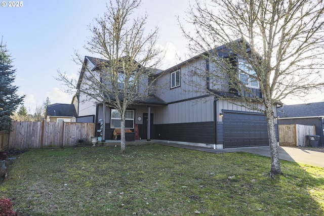 traditional home with board and batten siding, a front yard, fence, and driveway