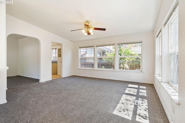 9341 N Pier Park Pl, Portland, OR 97203 - empty room with arched walkways, a ceiling fan, and carpet floors