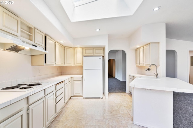 9341 N Pier Park Pl, Portland, OR 97203 - kitchen featuring white appliances, arched walkways, under cabinet range hood, recessed lighting, and cream cabinets