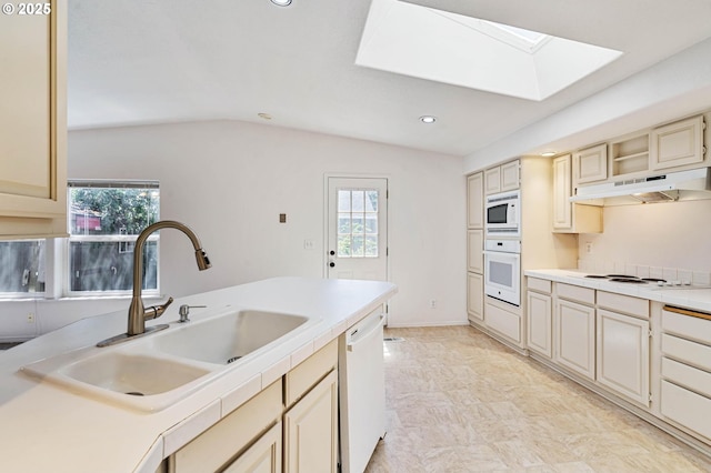 9341 N Pier Park Pl, Portland, OR 97203 - kitchen with white appliances, under cabinet range hood, cream cabinets, a skylight, and light countertops