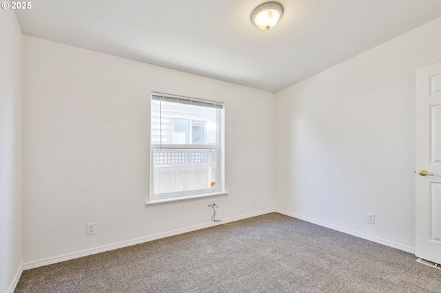 9341 N Pier Park Pl, Portland, OR 97203 - spare room featuring carpet floors and baseboards