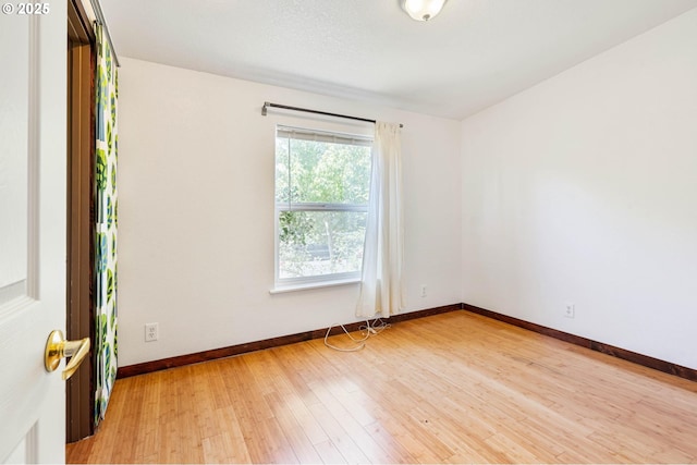 9341 N Pier Park Pl, Portland, OR 97203 - unfurnished room featuring baseboards and light wood-type flooring