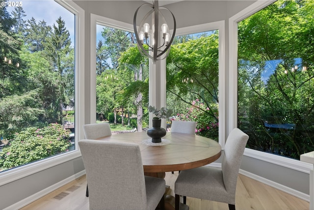 17595 Kelok Rd, Lake Oswego, OR 97034 - sunroom with a chandelier and view of wooded area