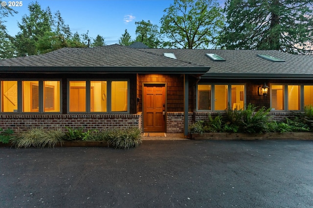 17595 Kelok Rd, Lake Oswego, OR 97034 - view of front of house featuring brick siding and roof with shingles
