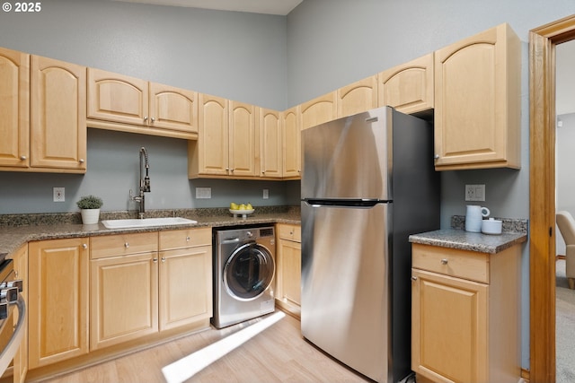 17595 Kelok Rd, Lake Oswego, OR 97034 - kitchen featuring washer / clothes dryer, stainless steel appliances, light brown cabinetry, and a sink