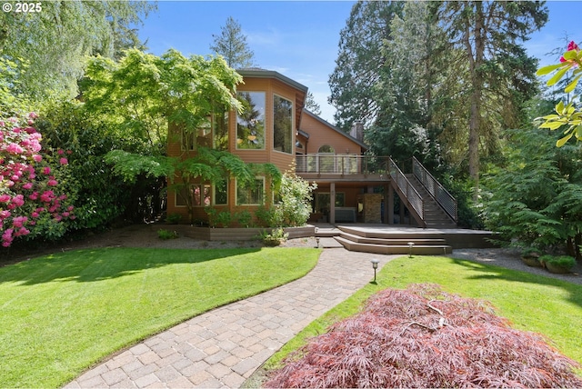 17595 Kelok Rd, Lake Oswego, OR 97034 - rear view of house with stairway, a yard, a deck, and stone siding