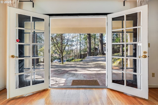 992 SW Westwood Dr, Portland, OR 97239 - doorway to outside featuring wood finished floors and french doors