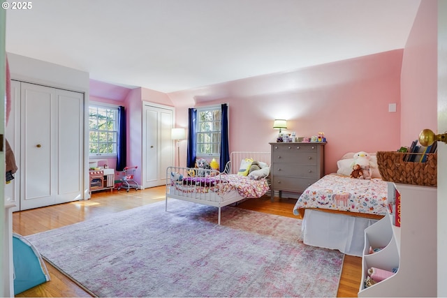 992 SW Westwood Dr, Portland, OR 97239 - bedroom with wood finished floors and two closets