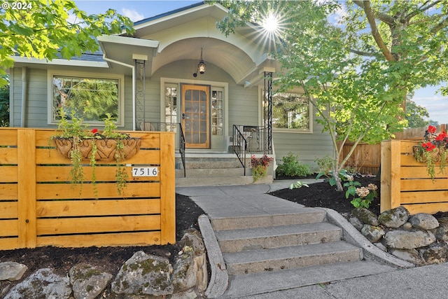 doorway to property with fence
