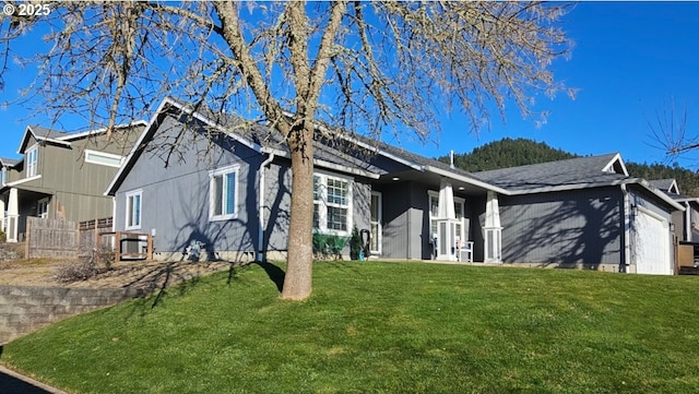 view of property exterior with central AC and a lawn