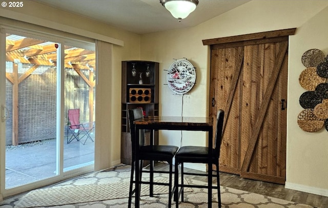 dining room featuring a wealth of natural light and wood-type flooring