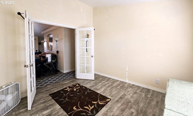 6004 Quartz Ave, Springfield, OR 97478 - interior space featuring french doors, wood finished floors, arched walkways, and baseboards
