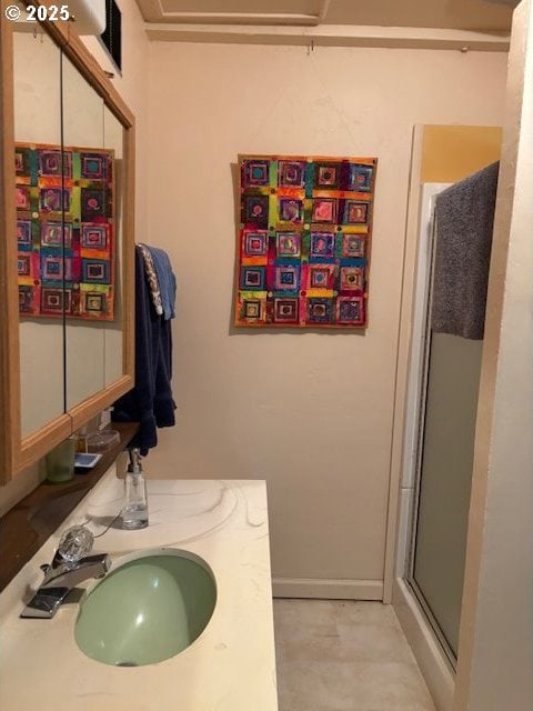 89384 Sutton Lake Rd, Florence, OR 97439 - bathroom featuring a sink, a shower stall, and baseboards