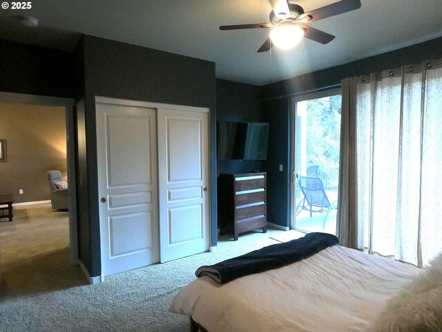 bedroom with light carpet, access to exterior, and a closet