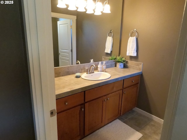 bathroom with tile patterned flooring and vanity