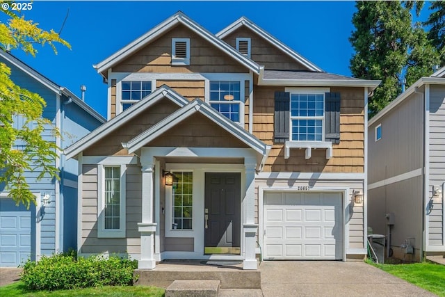 20657 SW Nantucket Ln, Beaverton, OR 97006 - view of front of property featuring a garage and driveway