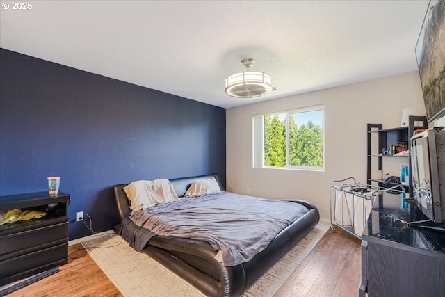 20657 SW Nantucket Ln, Beaverton, OR 97006 - bedroom featuring wood finished floors and baseboards