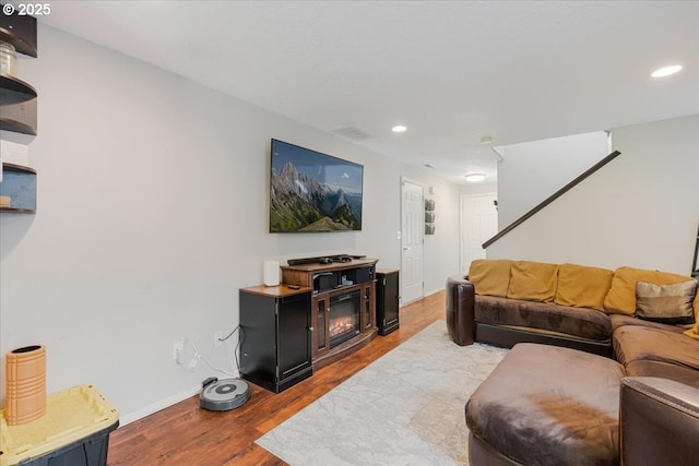 20657 SW Nantucket Ln, Beaverton, OR 97006 - living room with recessed lighting, wood finished floors, baseboards, and stairs