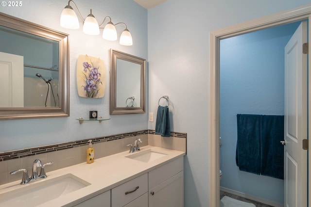 120 Sundance Ct, Roseburg, OR 97471 - bathroom featuring backsplash, toilet, and double vanity