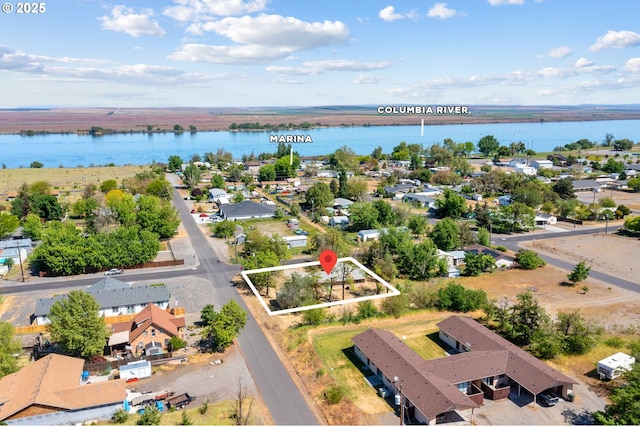 600 NE Oregon Ave, Irrigon, OR 97844 - aerial perspective of suburban area featuring a large body of water and property boundaries highlighted
