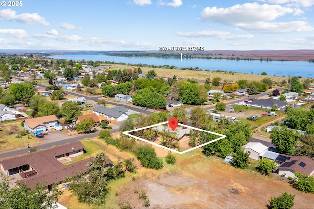 600 NE Oregon Ave, Irrigon, OR 97844 - aerial view of residential area with a nearby body of water and property parcel outlined
