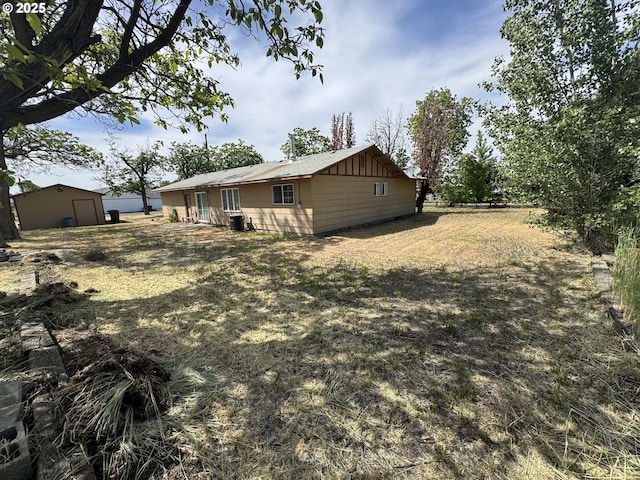 600 NE Oregon Ave, Irrigon, OR 97844 - back of house with board and batten siding and an outbuilding