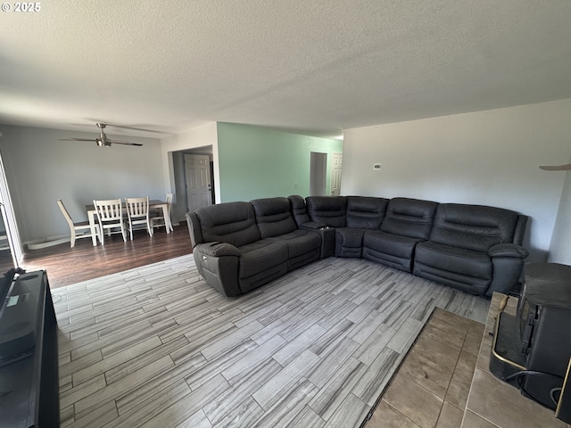 600 NE Oregon Ave, Irrigon, OR 97844 - living room featuring a ceiling fan, wood tiled floors, and a textured ceiling