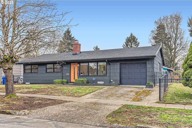 view of front facade featuring driveway, fence, a shingled roof, a garage, and a chimney