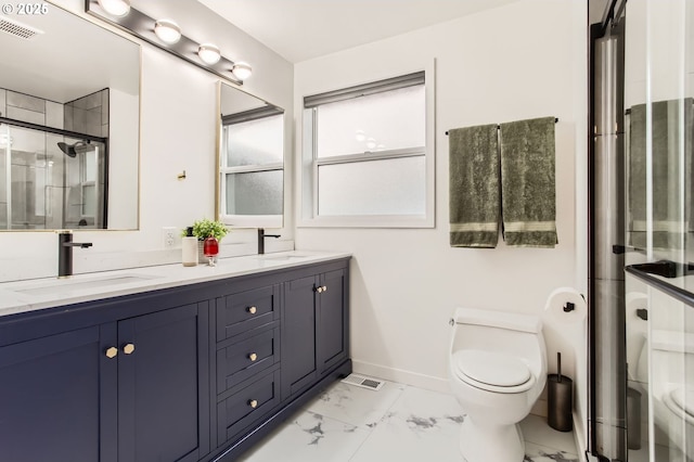 full bath featuring a sink, toilet, and marble finish floor