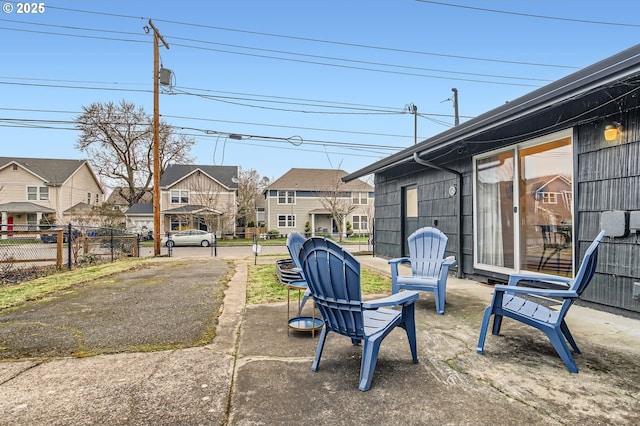 view of yard with a patio area, a residential view, and fence