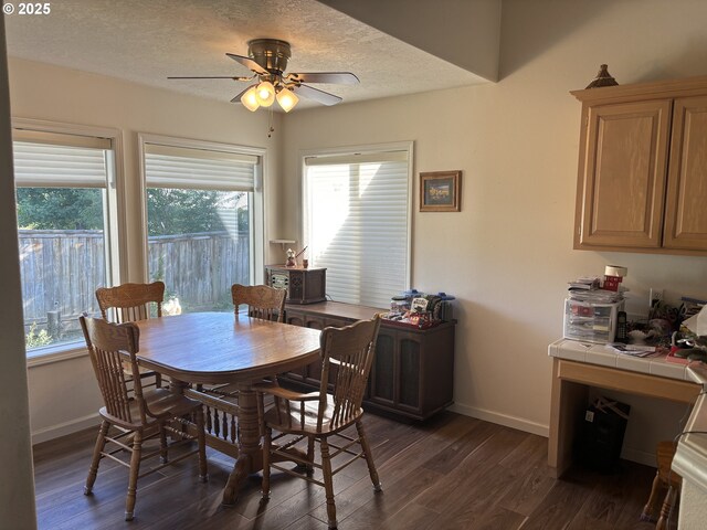 1350 Hidden Creek Dr NE, Keizer, OR 97303 - dining space featuring dark wood-style flooring, baseboards, ceiling fan, and a textured ceiling
