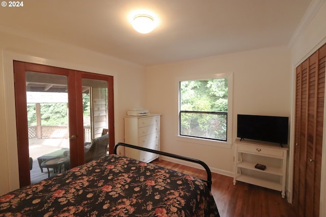 bedroom featuring baseboards, access to exterior, french doors, ornamental molding, and dark wood-style floors