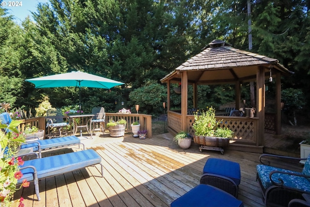 wooden deck featuring a gazebo