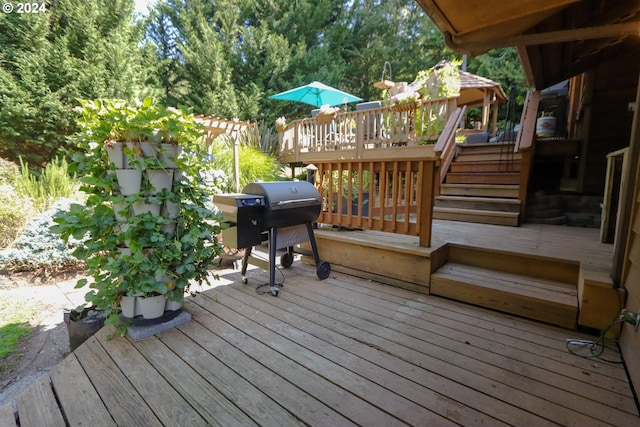 wooden deck with stairs and a grill