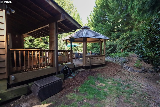 exterior space with a deck and a gazebo