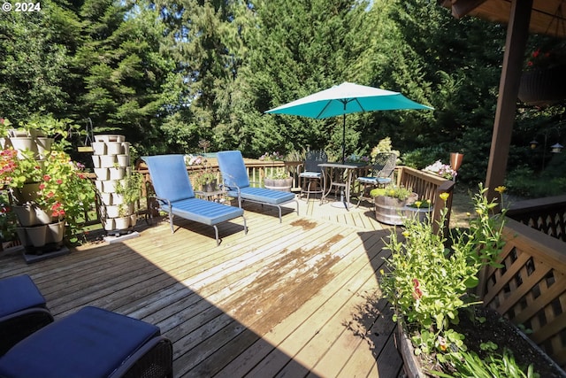 wooden deck featuring outdoor dining space