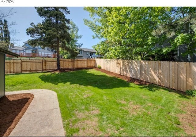 view of yard featuring a fenced backyard